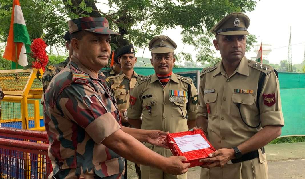 BSF offers sweets to its Bangladesh counterpart in Tripura on 77th Independence Day of India