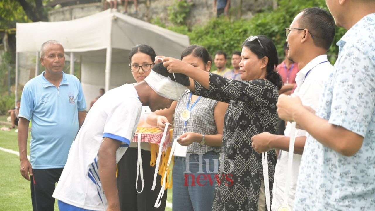 Nikseng Gittim lift championship trophy of Inter Church Father's Fellowship Football Tournament 2023