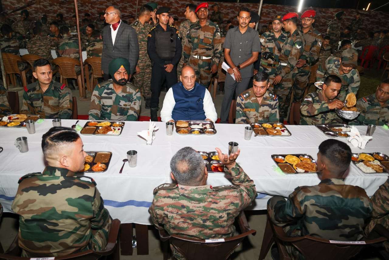 Assam: Defence Minister Rajnath Singh shares a meal with troops of Gajraj Corp