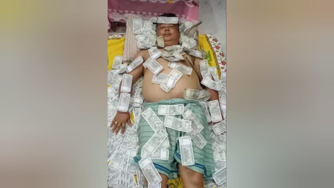 Bodo leader in a bed of cash