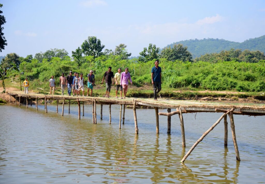 Left to their own devices: Kamrup villagers build bamboo bridge as government watchers look on