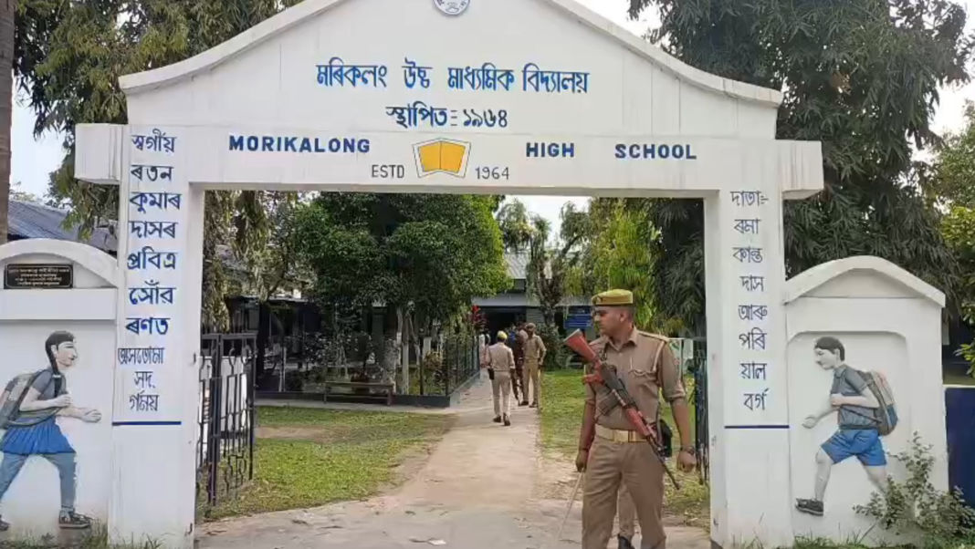 police or central forces standing outside polling station